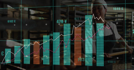 Korean bakery chef in apron pulling tray using peel amid racks in bakery. Artisan, industrial, productivity, craftsmanship, enterprise, modern, culinaryの写真素材