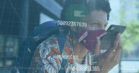 Man with red mask carrying backpack, speaking into phone near glass building, with data overlays. Technology, communication, urban, modern, connectivity, innovation, lifestyleの写真素材