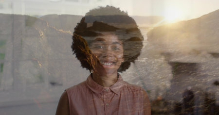 Blending smiling woman wearing blouse merging studio with rocky shore and sunset, double exposure. Portrait, landscape, ocean, elegance, serenity, minimalism, natural lightの写真素材