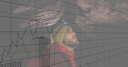 Man with headlamp, knit cap, red jacket and backpack navigating in rocky cave, with digital graphs. Adventure, exploration, analytics, data, technology, rugged, outdoorの写真素材