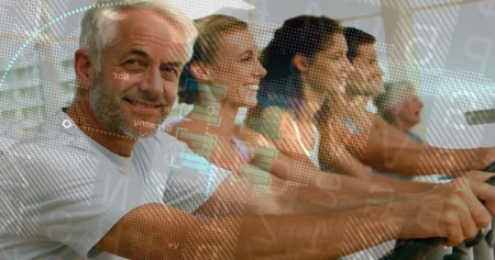 Exercising six adults using cardio machines at fitness studio, with digital overlays, copy space....