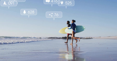 Sprinting surfers in rash guard and shorts carrying boards at beach. Aquatic, vitality, adventure, dynamic, coastal, energetic, youthの写真素材