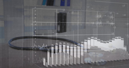 Displaying black cable with 3D data overlay on grey office desk, featuring gear piece and monitor....