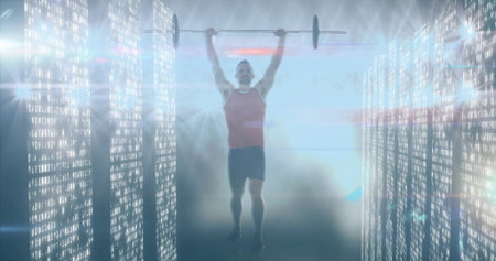Lifting athlete wearing red top, black shorts pressing barbell overhead in code corridor with mist. Futuristic, technology, fitness, strength, innovation, energy, modernの写真素材