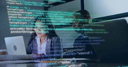 Software team analyzing code on glass screen in tech workspace, with laptop coffee mug and papers. Collaboration, innovation, technology, digital, workspace, modern, concentrationの写真素材