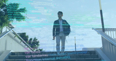 Standing mature Asian man wearing business-casual blazer on outdoor stairs, with code overlay. Professional, networking, modern, urban, technological, innovative, sophisticatedの写真素材