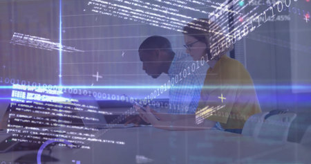 Collaborating software engineers coding at conference table, with laptop tablet pen code overlay. Digital, teamwork, innovation, modern, technology, brainstorming, productivityの写真素材