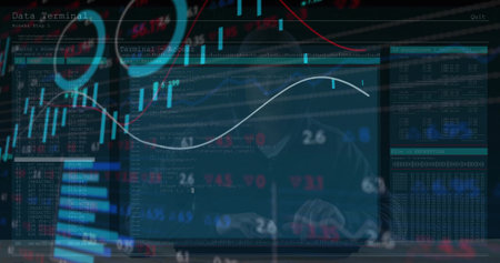 Typing hooded man focusing on keyboard and monitors displaying code and stock charts in dark office....