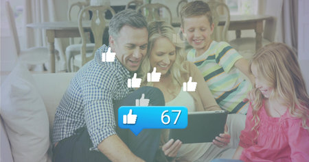 Leaning family viewing tablet on sofa in living room, with floating thumbs-up and like-count bubble....