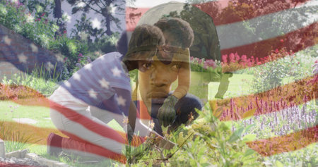 Showing camo helmeted soldier overlaying garden, with gardeners weeding under American flag overlay. Patriotic, outdoors, resilience, teamwork, organic, nurturing, vibrantの写真素材
