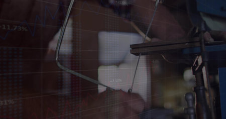 Operating machinist adjusting drill-press lever at workshop. Industrial, craftsmanship, technology, manufacturing, innovationの写真素材