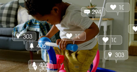 Riding toddler wearing yellow pants on blue ride-on toy in living room. Playful, childhood, leisure, domestic, colorful, modern, cozyの写真素材