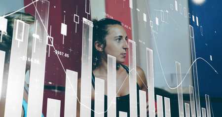 Analyzing workout partners in sports tops monitoring training metrics in gym, with data overlays....