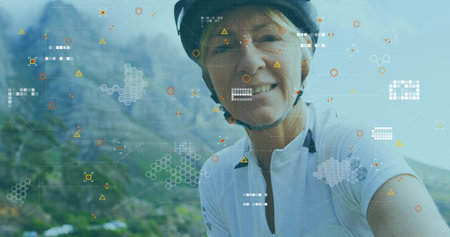 Taking selfie woman wearing cycling kit on mountain trail, with digital overlays copy space....