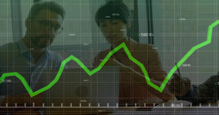 Collaborating professionals analyzing financial chart on laptop in office, with glass grid overlay. Business, teamwork, innovation, data, analytics, modern, corporateの写真素材