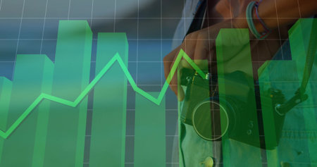 Photographer wearing denim jacket holding vintage camera against data chart grid, copy space. Artistry, analytics, innovation, vintage, creativity, finance, technologyの写真素材