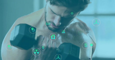 Lifting bare-chested athlete bicep curling hexagonal dumbbell at gym, with green energy icons. Fitness, strength, modern, sustainability, environment, health, wellnessの写真素材