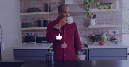 Drinking man wearing red long-sleeve shirt holding ceramic mug at kitchen island, brick backsplash. Rustic, modern, cozy, culinary, domestic, relaxation, interiorの写真素材