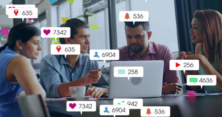 Team discussing social media data in meeting room, with laptop, sticky notes, notifications. Collaboration, brainstorming, digital, technology, innovation, professional, teamworkの写真素材