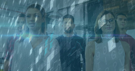 Standing group of software professionals examining digital code overlay in glass-partition office. Technology, collaboration, innovation, modern, workspace, digital, dataの写真素材