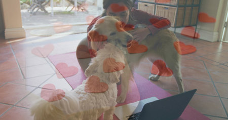Kneeling on pink mat in living room, woman wearing red top, dark leggings, hugging golden retriever....