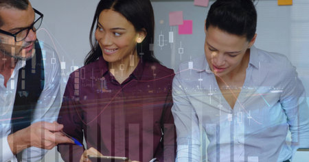 Professionals in business attire collaborating at desk reviewing tablet with data charts. Collaboration, analytics, teamwork, corporate, data, strategy, progressの写真素材
