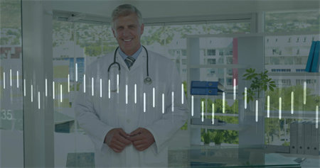 Doctor standing in clinic office, with stethoscope and lab coat near glass desk and shelving unit....