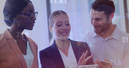 Guiding business professionals analyzing chart overlays in office, with tablet and smartphone....