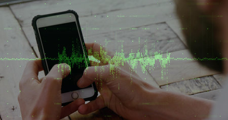 Man wearing short sleeves viewing phone screen at wooden table, with green waveform overlay....