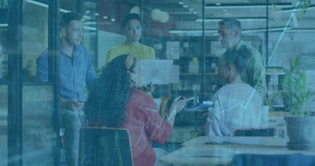 Collaborating five member team discussing financial data in office, with laptop tablet documents. Collaboration, teamwork, brainstorming, modern, professional, data analysis, enterpriseの写真素材