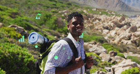 Hiking man wearing shirt watch carrying backpack, sleeping pad on rocky trail. Adventure, exploration, wilderness, active, outdoor, expedition, ruggedの写真素材
