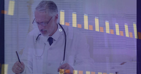 Writing senior doctor annotating patient notes at office desk with chart overlay and stethoscope. Medical professional, analytics, healthcare, consultation, data visualization, clinical, diagnosticの写真素材