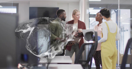 Viewing 3D particle swirl on glass wall in office four professionals holding laptops, tablets....