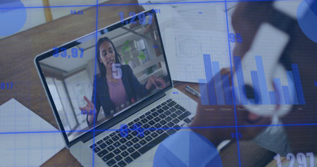 Showing woman speaking on laptop at office, charts, grid diagrams, two smartphones, writing tools....