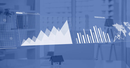 Displaying semi-transparent line, bar and map panels over office desk, featuring mini house model....