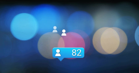 Floating three white user icons around bright blue notification bubble on screen, bokeh background. Abstract, interface, minimalism, digital, technology, communication, infographicの写真素材