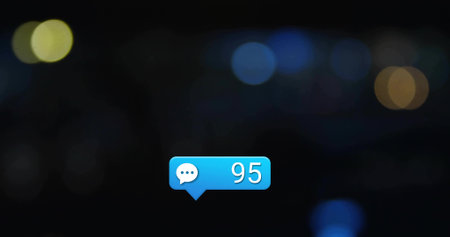 Floating blue message bubble showing speech icon and number 95 in dark blurred city background. Notification, communication, digital, interface, technology, neon, futuristicの写真素材