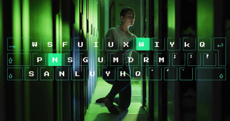 Kneeling tech testing server racks and data cables in green lit data center, with keyboard overlay....