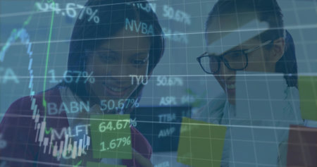 Financial analysts wearing business attire studying stocks on tablet in office, with ticker overlay....