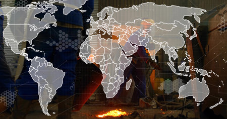 Forging molten metal, male metalworker standing at foundry workshop with digital network overlay....