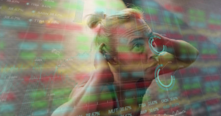 Stretching blonde fitness model holding hands behind head in montage, with floating stock charts.の写真素材