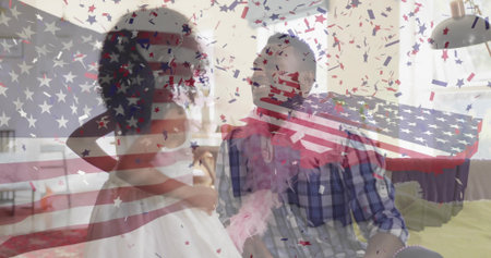 Father and daughter playing dress-up in living room wearing tulle dress, boa with confetti overlay. Family, celebration, festive, casual, warmth, happiness, bondingの写真素材