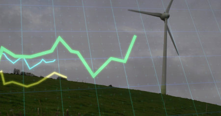Standing 3-blade turbine on grassy shrubby hill with teal grid and line graph overlay, copy space. Renewable, sustainability, energy, technology, environment, climate, dataの写真素材