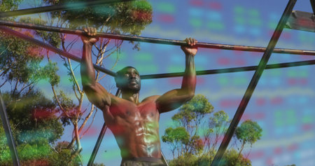 Pulling muscular shirtless man executing pull-ups on horizontal metal bar in outdoor fitness area....