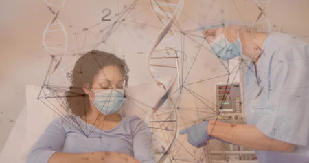 Pointing nurse showing infusion pump beside patient receiving IV line in hospital with DNA graphics. Medical, healthcare, science, technology, patient, professional, clinicalの写真素材