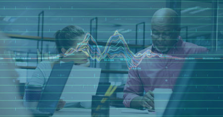 Holding report writing notes, colleagues in business attire at office with laptop, data overlay. Collaboration, professionalism, analytics, workspace, productivity, teamwork, corporateの写真素材