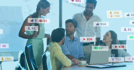 Collaborating team of five professionals analyzing overlays in office, with laptop coffee cup. Business, teamwork, innovation, modern, analytics, communication, digitalの写真素材
