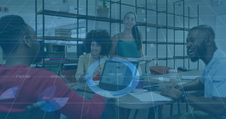 Four business professionals discussing data in office area, with two laptops and printed charts. Collaboration, teamwork, analytics, modernity, productivity, corporate, brainstormingの写真素材