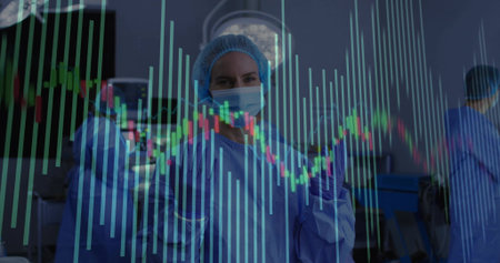 Reviewing chart overlay, lead surgeon in blue scrubs in operating room with overhead lights. Medical, teamwork, healthcare, modern, precision, professionalism, clinicalの写真素材