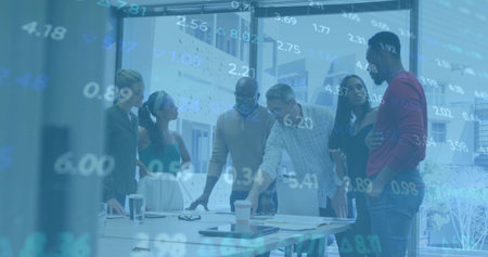 Reviewing professionals in business attire studying charts and floating figures on table in office. Corporate, teamwork, data, analytics, modern, collaboration, strategyの写真素材